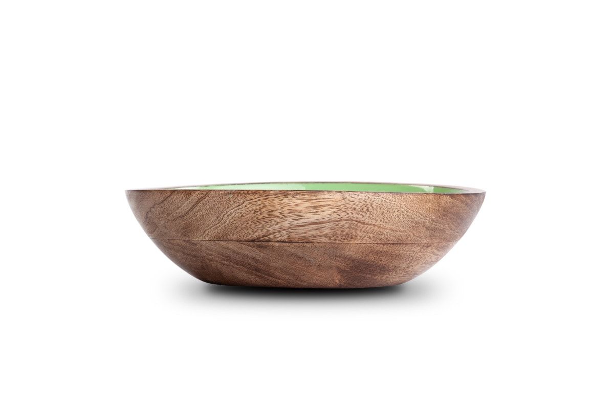 Oval wooden serving bowl with a green lacquered inside, on a white background